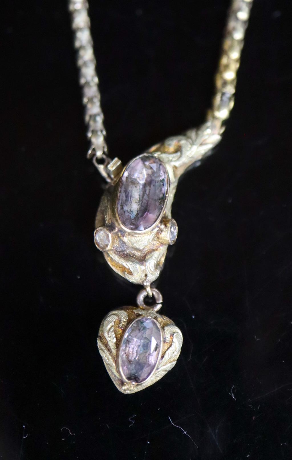 An early Victorian two colour gold and foil backed topaz? set mourning drop necklace,